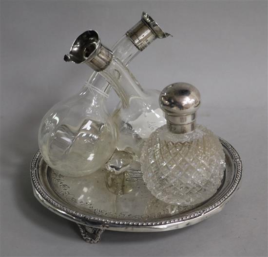 A silver waiter, a silver-mounted oil and vinegar bottle and a similar perfume bottle.